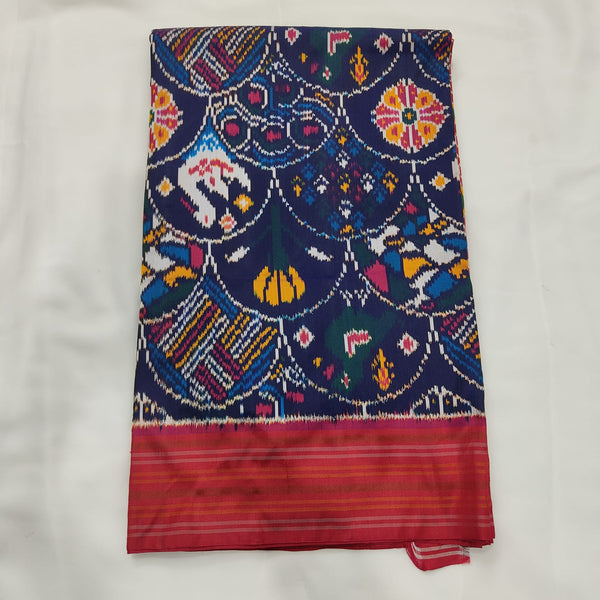 Navy blue Patola ikat silk saree with multicolour motifs and a pink contrast border